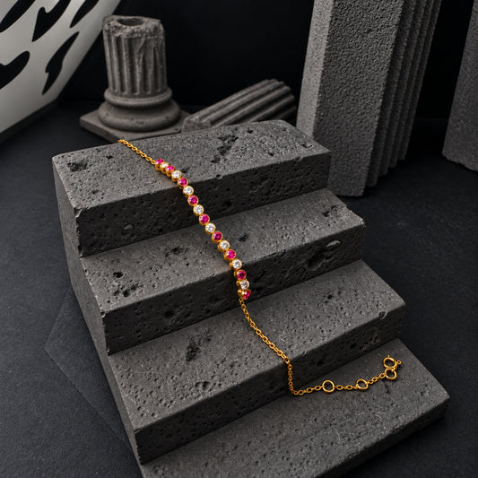 YYBR005 yellow gold alternating red/pink and clear bracelet front view