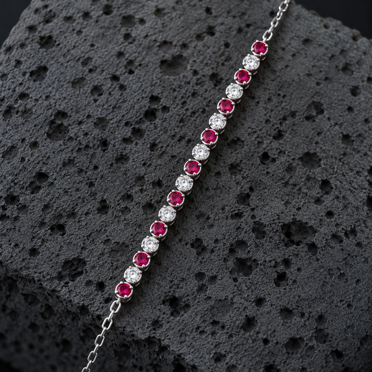 YYBR006 silver bracelet alternating red and clear gemstones
